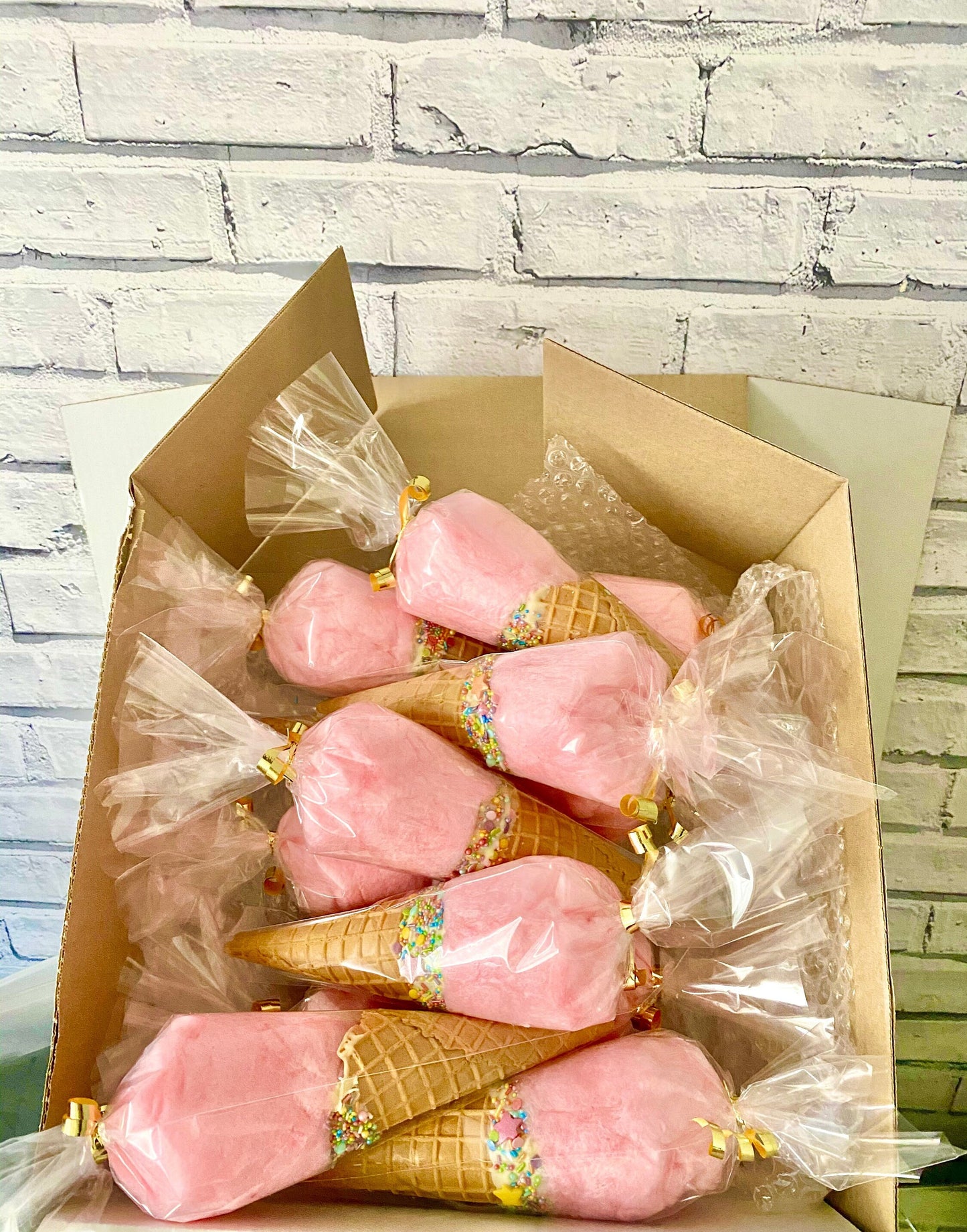 Pink vanilla candy floss cones with rainbow sprinkles